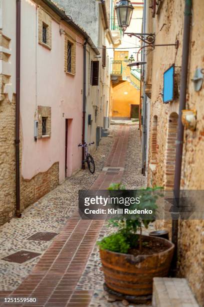 a narrow street in a small italian town - abruzzo stock pictures, royalty-free photos & images