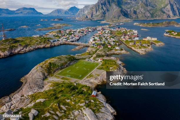 aerial view of a mountain overlooking a group of islands in henningsvær, norway - henningsvær stadion bildbanksfoton och bilder