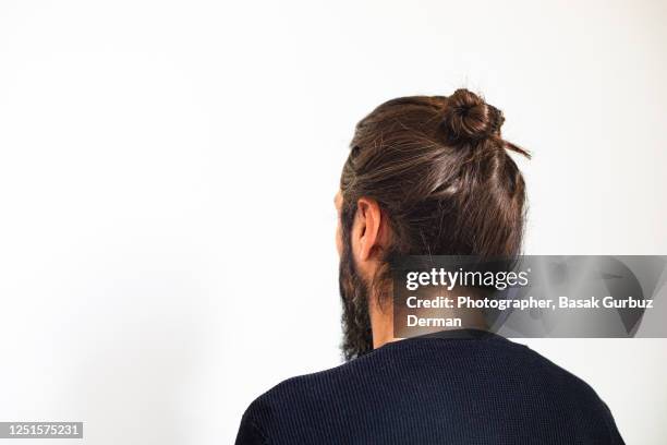 a man with man bun - man bun stock pictures, royalty-free photos & images