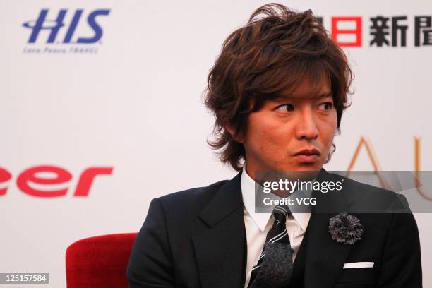 Kimura Takuya of Japanese boy band SMAP attends a press conference ahead of Beijing concert at the Great Hall of the People on September 15, 2011 in...