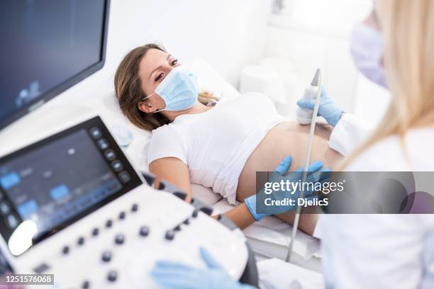 pregnant woman on ultrasound. - gynaecologist exam stock pictures, royalty-free photos & images