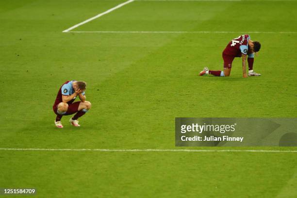 Ryan Fredericks of West Ham United and Jarrod Bowen of West Ham United looks dejected following their side's defeat in the Premier League match...