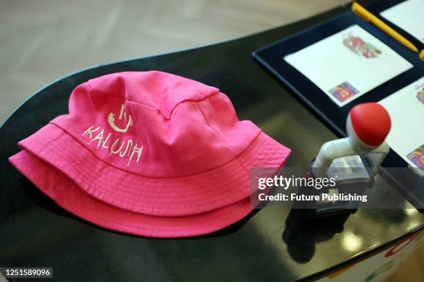 Pink bucket hats, a signature piece of Oleh Psiuk, are pictured during the special cancellation ceremony of the Kalush Orchestra series at the...