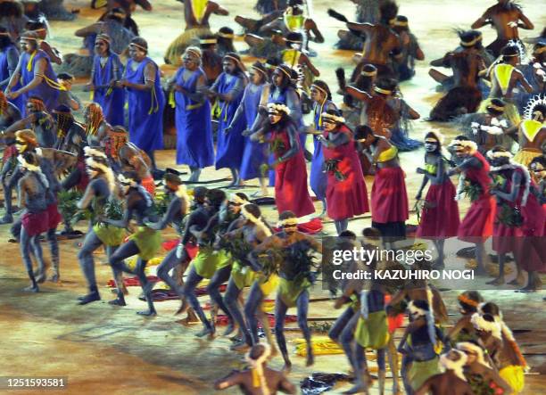Performs enact an aboriginal dance during the "Djakapurra and clans and Wandjina" segment 15 September 2000 during the opening ceremony of the Sydney...