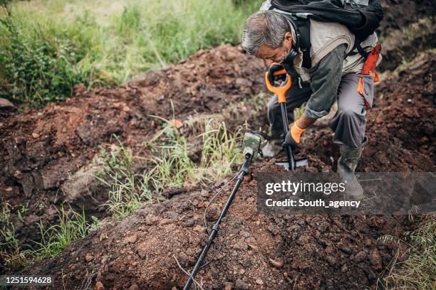 Man Digging Rocks People Digging For Gold Photos and Premium High Res Pictures - Getty Images