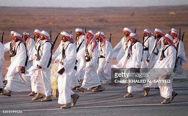 Saudi soldiers march during a military parade celebrating the 100th anniversary of al-Saud dynasty in Riyadh 26 January. In 1902 Abdel Aziz ibn Saud...