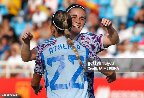 Spain's midfielder Teresa Abelleira celebrates scoring the opening goal, with Spain's forward Athenea del Castillo, during the women's international...