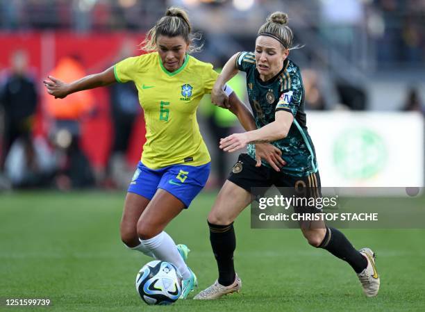 Brazil's defender Tamires and Germany's midfielder Svenja Huth vie for the ball during the women's international friendly football match between...