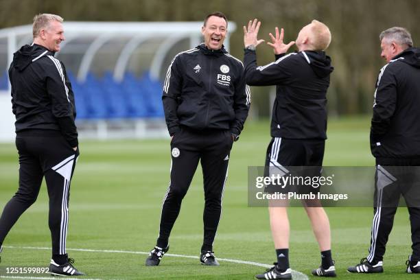 Leicester City manager Dean Smith with John Terry first team coach and Adam Sadler Leicester City first team coach during the Leicester City training...