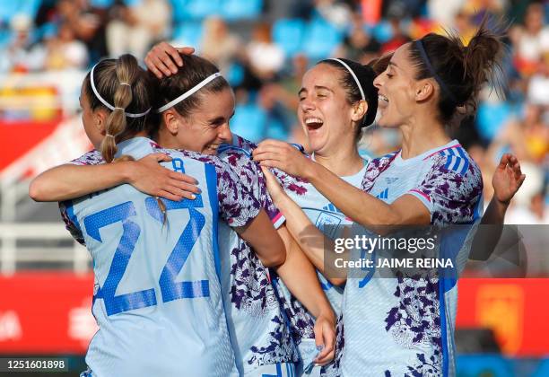 Spain's midfielder Teresa Abelleira celebrates scoring the opening goal, with teammates, during the women's international friendly football match...