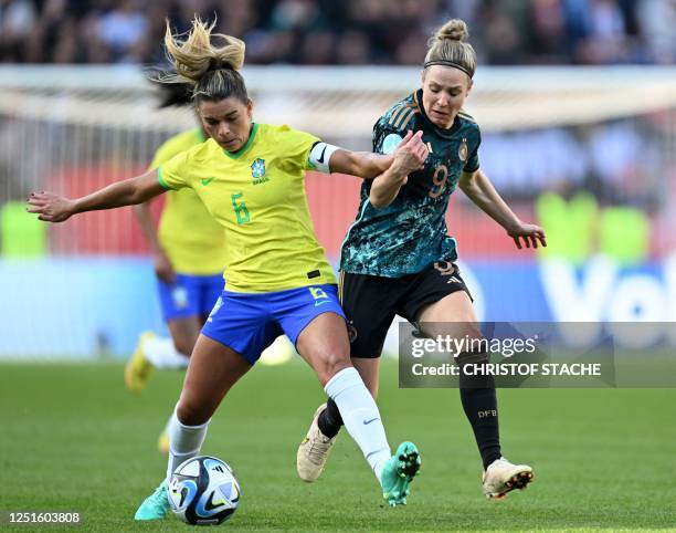 Brazil's defender Tamires and Germany's midfielder Svenja Huth vie for the ball during the women's international friendly football match between...