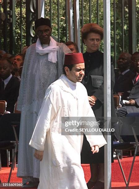 Moroccan crown prince Moulay Rachid returns to his chair after presenting his condolence to Senegalese President Abdoulaye Wade and to Leopold Sedar...