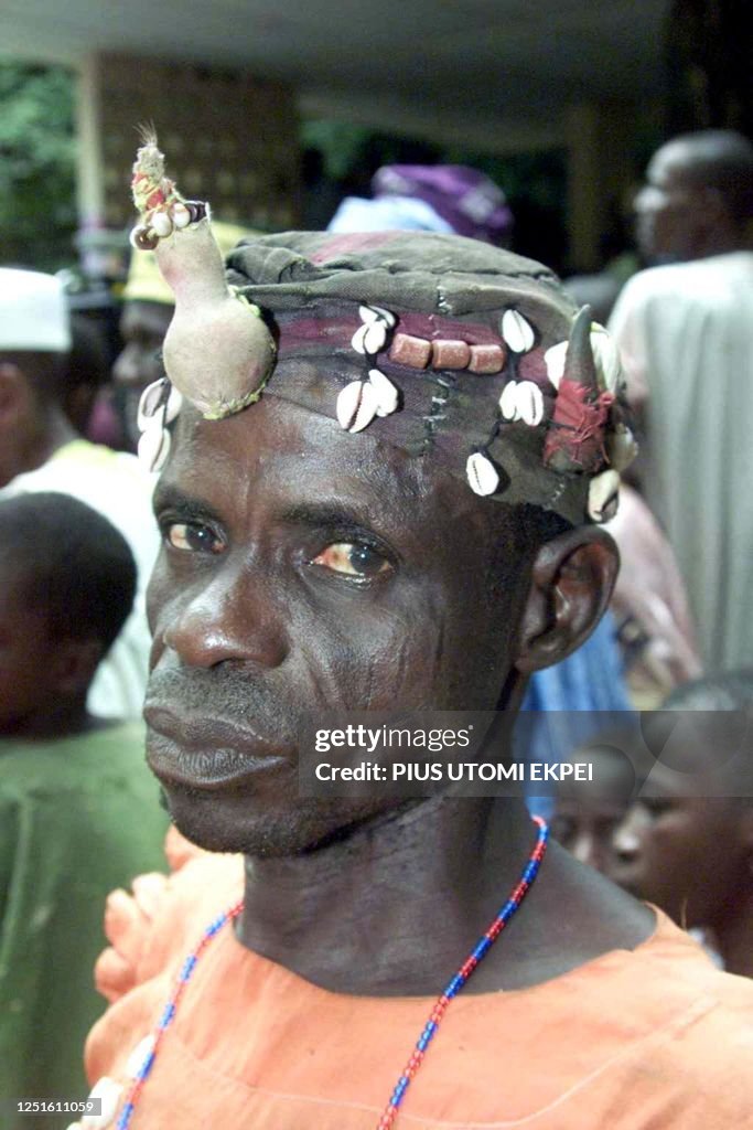 Magun A Yoruba man wearing traditional magical 'charms' on his head attends ...