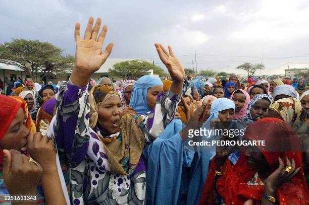 Somaliland women dance as they queue up to cast their ballots at a polling station in Hargeisa, Somalia, 31 May 2001 during the constitutional...