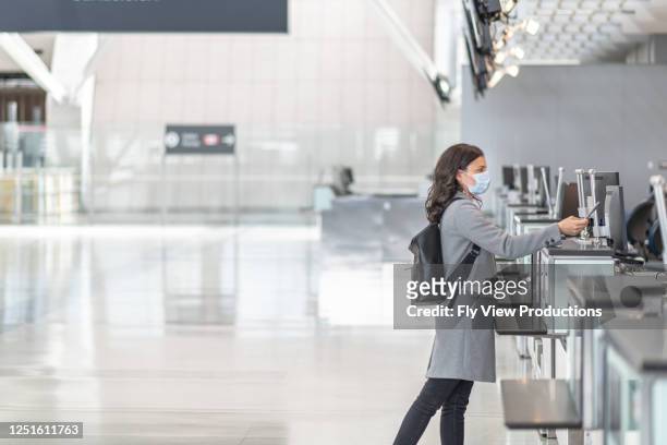 ein alleinreisender an einem leeren flughafen - canadian passport stock-fotos und bilder