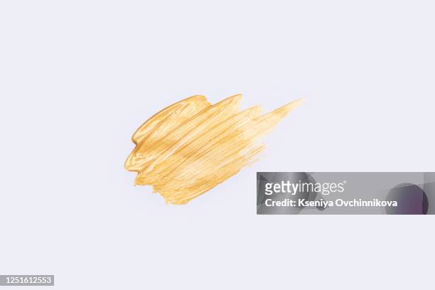beautiful textured golden strokes isolated on white background. - colpire foto e immagini stock