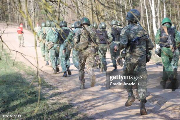 Security forces of the Belarusian Ministry of Internal Affairs attend the qualification tests for wearing krapovy berets at the training center of...