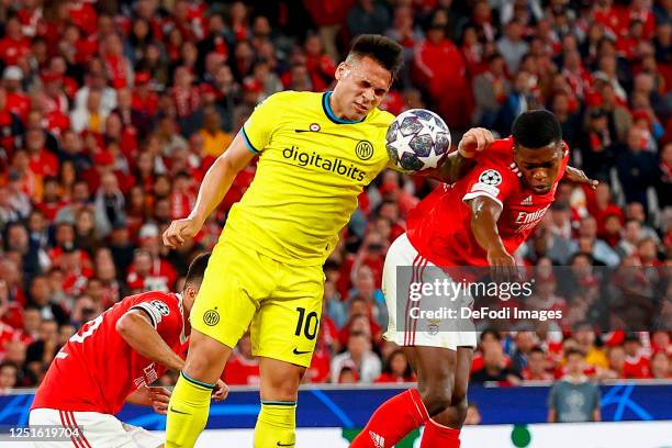 Lautaro Martinez of FC Internazionale and Florentino of Benfica Lissabon battle for the ball during the UEFA Champions League quarterfinal first leg...