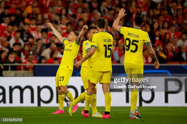 Nicolo Barella of FC Internazionale celebrates after scoring his team's first goal with teammates during the UEFA Champions League quarterfinal first...