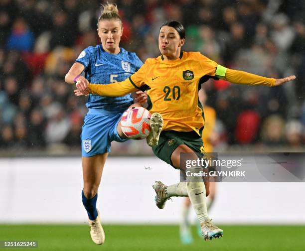 England's midfielder Leah Williamson Australia's forward Sam Kerr vies with during the International football friendly match between England and...