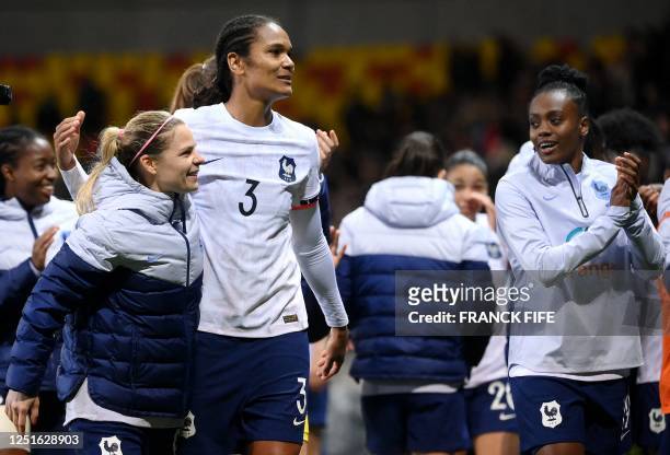 France's forward Eugenie Le Sommer and France's defender Wendie Renard react at the end of the women's international friendly football match between...