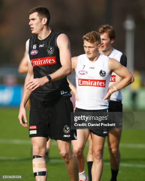 Mason Cox and Adam Treloar of the Magpies during a Collingwood Magpies AFL training session at Holden Centre on June 24, 2020 in Melbourne, Australia.