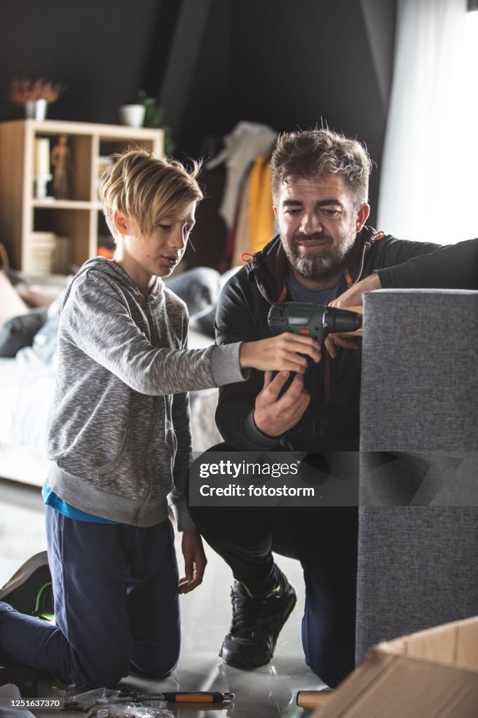 Father and son working together in building a new chair