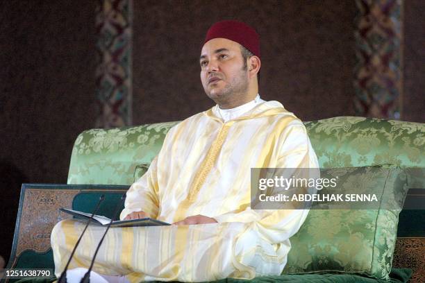 King Mohammed VI of Morocco prays late 13 May 2003 at the Casablanca mosque during celebrations on the eve of the Mouled festival, commemorating the...