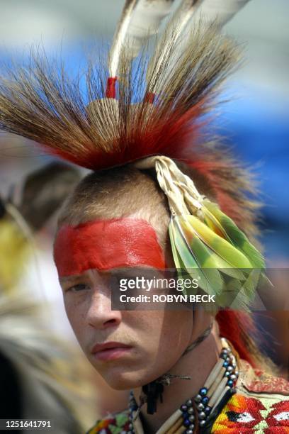 Cody Jacobs of the Lumbee Native American Indian tribe concentrates before performing in a competitive traditional dance at a powwow in Urbana,...