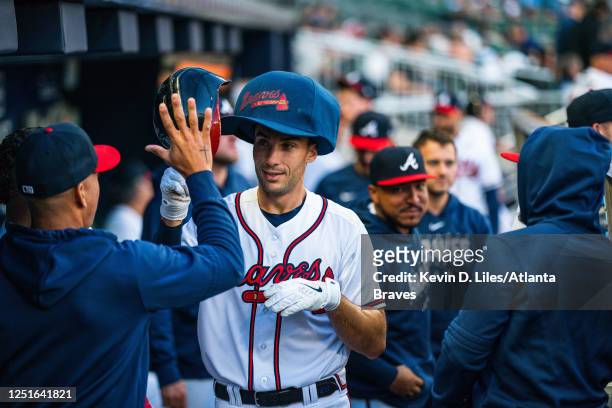 Matt Olson of the Atlanta Braves celebrates hitting a solo home run during the first inning against the Cincinnati Reds at Truist Park on April 11,...