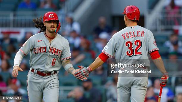 Jonathan India of the Cincinnati Reds celebrates scoring with the bases loaded on a hit batsman with Jason Vosler in the third inning against the...