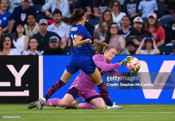 Missouri , United States - 11 April 2023; Republic of Ireland goalkeeper Courtney Brosnan makes a save ahead of Alex Morgan of United States during...
