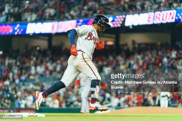 Ozzie Albies of the Atlanta Braves hits his 100th career home run during the fourth inning against the Cincinnati Reds at Truist Park on April 11,...