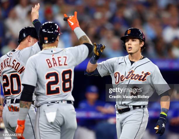 Nick Maton of the Detroit Tigers celebrates with Spencer Torkelson and Javier Baez after hitting a 3-run home run in the second inning against the...