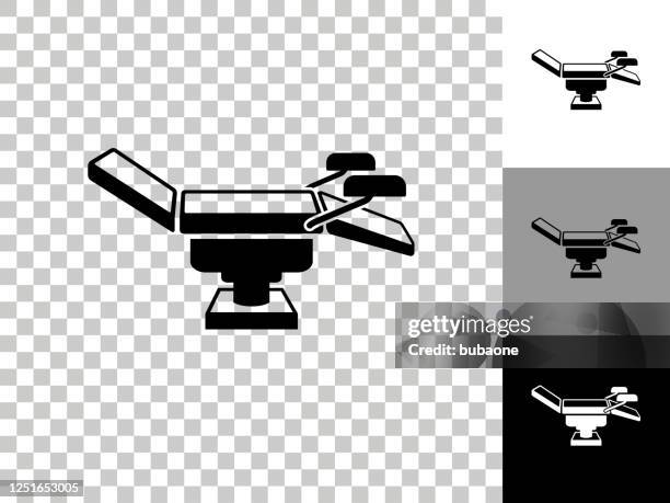 examination table icon on checkerboard transparent background - examination table stock illustrations