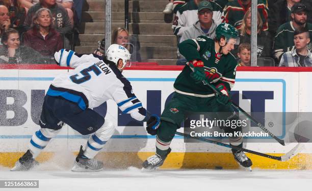 Kirill Kaprizov of the Minnesota Wild skates with the puck in the first period of the game against the Winnipeg Jets at Xcel Energy Center on April...