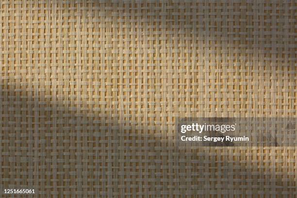 wicker straw texture with lighting - wicker mat stock pictures, royalty-free photos & images