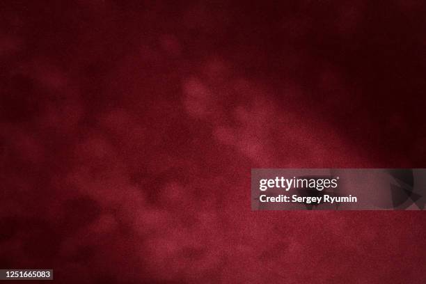 burgundy velvet with lighting - felt textile stock-fotos und bilder