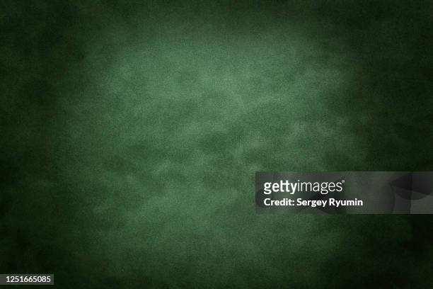 green velvet with lighting - green background stock-fotos und bilder