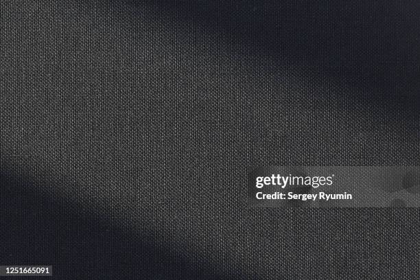 black canvas with lighting as a background - texture tessuto foto e immagini stock