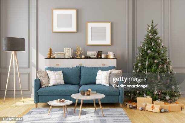 picture frame, sofa and christmas tree in living room - winter house stock pictures, royalty-free photos & images