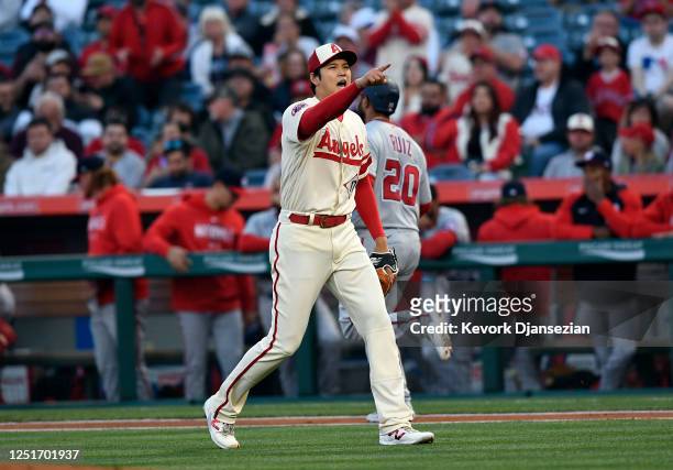 Starting pitcher Shohei Ohtani of the Los Angeles Angels reacts after the last out against Keibert Ruiz of the Washington Nationals in the first...
