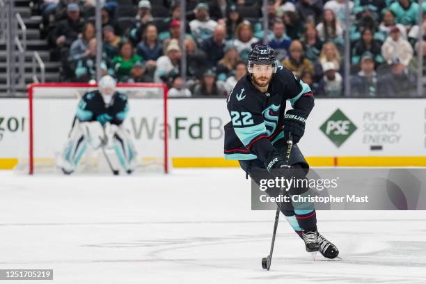 Oliver Bjorkstrand of the Seattle Kraken skates with the puck at center ice during the third period of a game against the Arizona Coyotes at Climate...