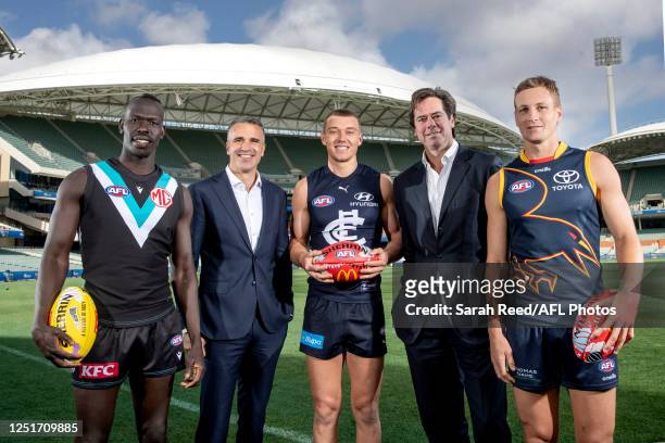 Gillon McLachlan, CEO of the AFL and the Premier of South Australia Peter Malinauskas stand with Aliir Aliir, Patrick Cripps of the Blues and Jordan...