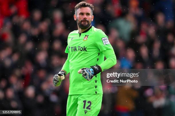 Ben Foster of Wrexham celebrates after Paul Mullin of Wrexham scored a goal to make it 1-1 during the Vanarama National League match between Wrexham...