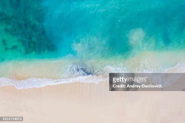 bali, aerial view of a beach - blue transparent ocean and white sand. - clear sky stock pictures, royalty-free photos & images