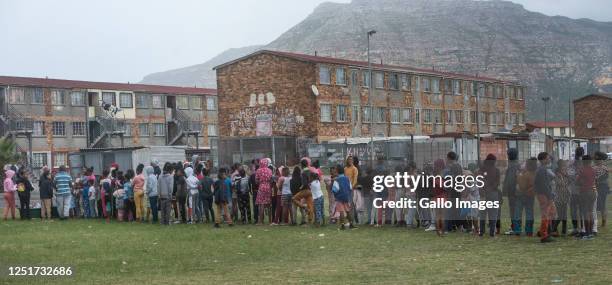 Close to a thousand children received a hot cross bun and a easter egg on Good Friday on the notorious ' Battlefield' in Lavender Hill and...