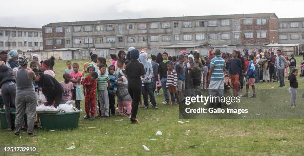 Close to a thousand children received a hot cross bun and a easter egg on Good Friday on the notorious ' Battlefield' in Lavender Hill and...