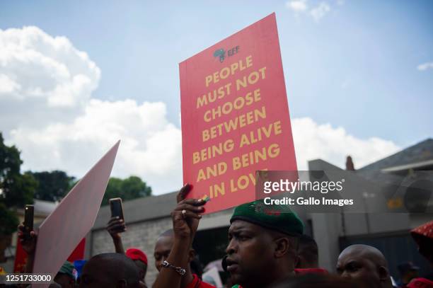 Members of the Economic Freedom Fighters picket against Uganda's anti-homosexuality bill at the Uganda High Commission on April 04, 2023 in Pretoria,...