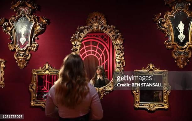 Christie's employee poses in London on April 12 during a photocall to promote the auctioneer's forthcoming pre-sale highlights exhibition of 'The...